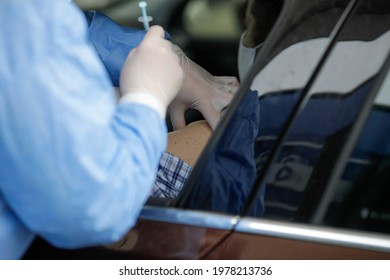 Details With People Getting Covid-19 Vaccines In Their Arms Right In Their Cars, In A Drive Thru Vaccination Centre In Bucharest, Romania.