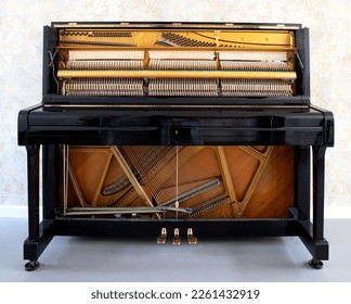 Details of piano mechanism gavel - string, pins and hammers, piano from 1973 - Powered by Shutterstock