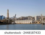Details of the Port of Genoa, Italy, with the lighthouse, called Lanterna. The Port of Genoa is the major italian seaport. The lighthouse was rebuilt in current shape in 1543. 