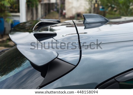 Details of racing, motorsport, extreme and motoring concept - close up of sports car back spoiler