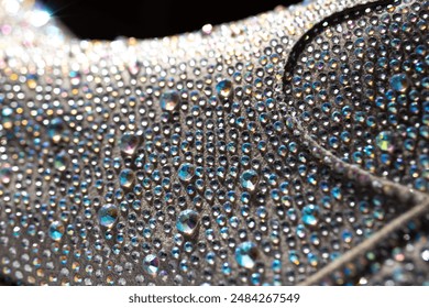 Details of a rhinestone cowgirl boot up close catching the light and sparkling