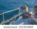 details of sailing equipment on a boat when sailing on the water in a sunny day