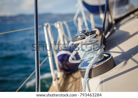 details of sailing equipment on a boat when sailing on the water in a sunny day