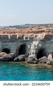 Details Of Sea Caves (littoral Caves) Near Ayia Napa, Mediterranean Sea Coast, Cyprus With Clear Blue Water And Rockery Backdrop, East Of The Beaches Of Pantahou And Glyky Nero