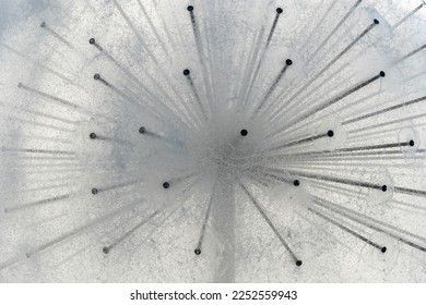 Details spherical fountain spraying water close up. Transparent splash in form ball. Fanshaped structure how dandelion blowball. Gush water and movement drops. Refreshing cool water on hot summer day.
