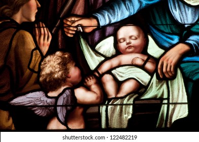 Details of stained glass window depicting baby Jesus at Christmas