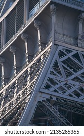 Details of the structure of Eiffel Tower landmark building from Paris, France, in a sunny day