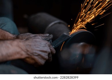 Details of welding work with worker's hands, close up - Powered by Shutterstock