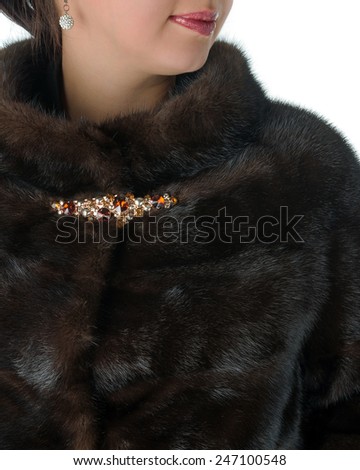 Details of women's winter coats mink brown color with a beautiful clasp