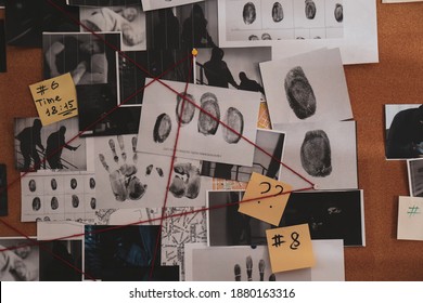 Detective board with crime scene photos, stickers, clues and red thread, closeup - Shutterstock ID 1880163316
