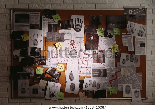 Detective board with\
fingerprints, photos, map and clues connected by red string on\
white brick wall
