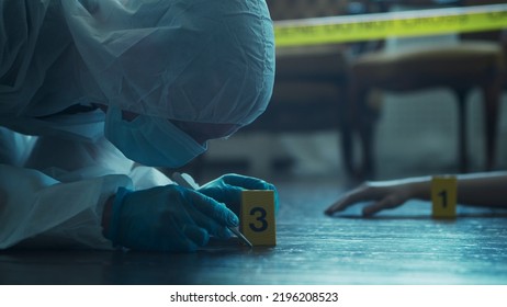 Detective Collecting Evidence In A Crime Scene. Forensic Specialists Making Expertise At Home Of A Dead Person. Homicide Investigation By Professional Police Officer.