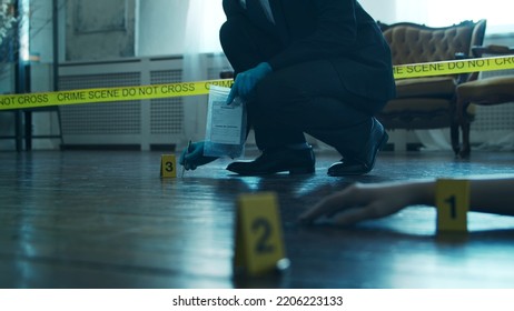 Detective Collecting Evidence In A Crime Scene. Forensic Specialists Making Expertise At Home Of A Dead Person. Homicide Investigation By Professional Police Officer.