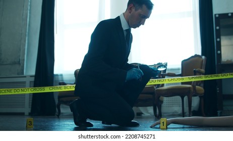 Detective Collecting Evidence In A Crime Scene. Forensic Specialists Making Expertise At Home Of A Dead Person. Homicide Investigation By Professional Police Officer.