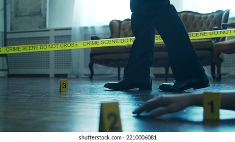 Detective Collecting Evidence In A Crime Scene. Forensic Specialists Making Expertise At Home Of A Dead Person. Homicide Investigation By Professional Police Officer.