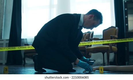 Detective Collecting Evidence In A Crime Scene. Forensic Specialists Making Expertise At Home Of A Dead Person. Homicide Investigation By Professional Police Officer.