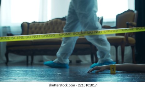 Detective Collecting Evidence In A Crime Scene. Forensic Specialists Making Expertise At Home Of A Dead Person. Homicide Investigation By Professional Police Officer.