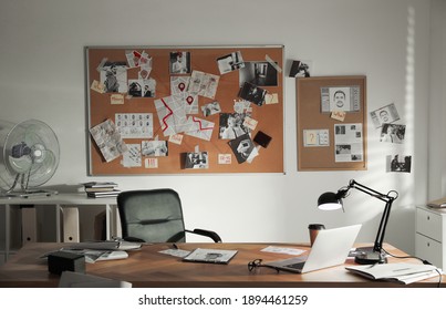 Detective Office Interior With Big Wooden Desk And Evidence Board