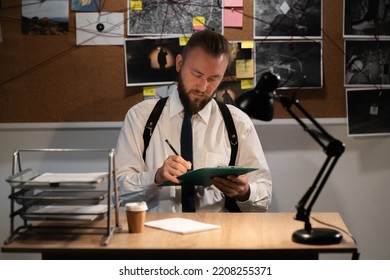 Detective Working In The Office At His Desk, Investigator At Work, Copy Space