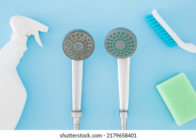 Detergent bottle, brush, sponge for shower head cleaning on blue table background. Pastel color. Limescale removing. Closeup. Problem and solution. Compare two objects with and without limestone.