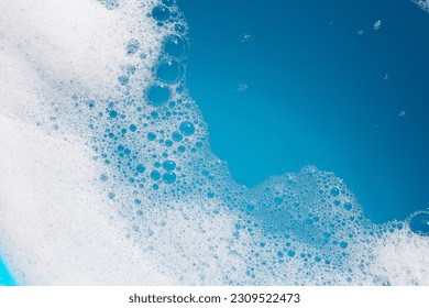 Detergent foam bubble on water. Blue background, Soap sud - Powered by Shutterstock