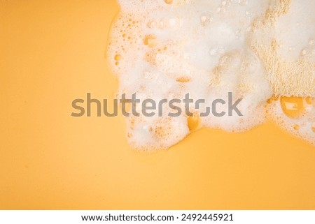 Detergent Foam Texture Background, Lather Pattern, Soap Bubbles on Yellow Color Surface, Soap Foam Wallpaper with Copy Space