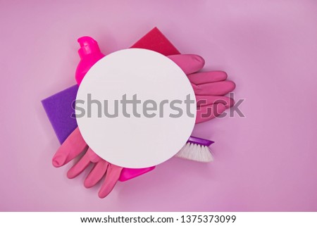 Detergents and cleaning accessories in pink color. Cleaning service, small business idea. Flat lay, Top view.