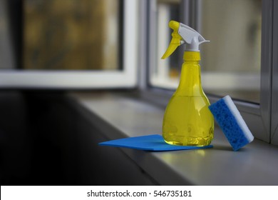Detergents and sponges on the windowsill