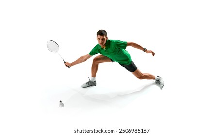 Determination and endurance on court. Focused male badminton player practicing, playing with intensity isolated on white background. Concept of sport, competition, active and healthy lifestyle - Powered by Shutterstock