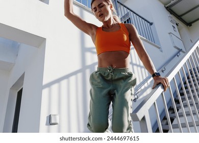 Determined Fitness Woman Jumping During Her Intense Workout. - Powered by Shutterstock