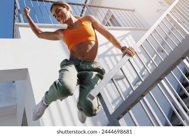 Determined Fitness Woman Jumping During Her Intense Workout. - Powered by Shutterstock