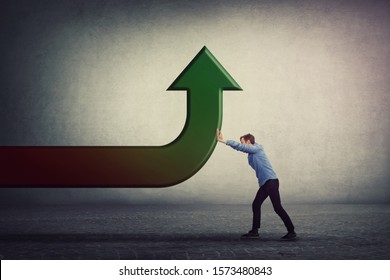 Determined Man Pushing An Arrow To Change The Direction, Bent Trajectory To Go Up. Business Purpose Achieving Success. Raising Graph, Progress And Growth Concept. Different Thinking, Alternative Idea.