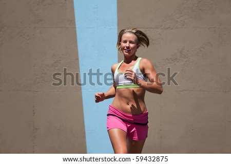 Determined woman runs for a healthy lifestyle. Stock photo © 