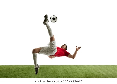 Determined young man, football player in motions during game, training, hitting ball and falling down isolated on white background. Concept of professional sport, game, competition, tournament, action - Powered by Shutterstock