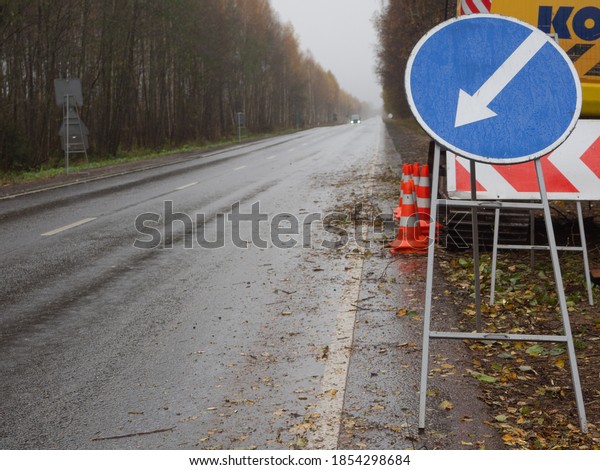 detour sign on the right. temporary road signs on\
the road. repair of\
roads