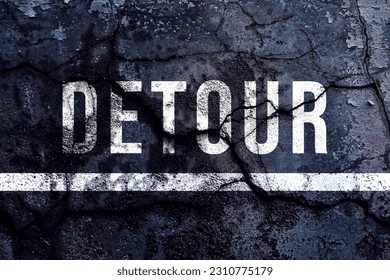 Detour text written with broken cement wall, Detour word on street.