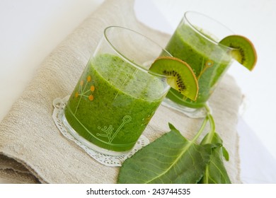 Detox Green Smoothie With Kiwi And Green Sorrel. Green Sorrel Leaves In The Background