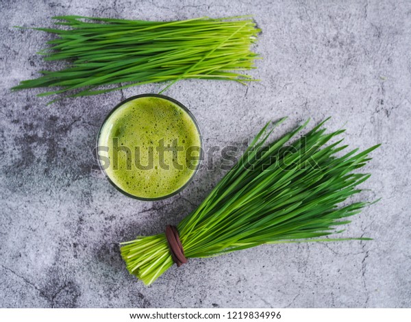 Detox juice mix with wheatgrass and green apple.\
Nutrition food concept.