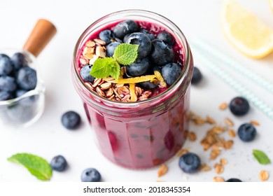 Detox Purple Acai Blueberry Smoothie In Glass On White Background, Top View