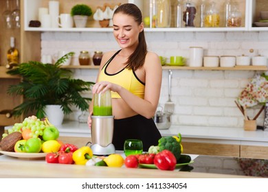 Detox Vegan Diet. Woman Making Green Juice With Machine - Powered by Shutterstock