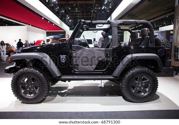 DETROIT\
- JANUARY 10: 2011 The special edition  Call of Duty Black Ops Jeep\
on display at the 2011 North American International Auto Show Press\
Preview on January 10, 2011 in Detroit,\
Michigan.