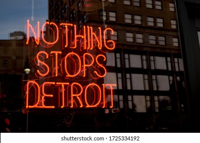 Detroit, MI - December 2019: Neon sign in window that reads "Nothing stops Detroit" with building reflection. Clothing and accessories store that supports local communities downtown Detroit