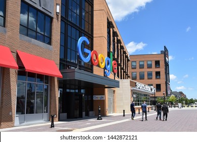 DETROIT, MI / USA - JUNE 30, 2019:  People Walk Past The New Google Offices Next To The Little Caesars Arena.