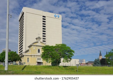  Detroit, Michigan - June 2020: Blue Cross, Blue Shield Building With Church In Foreground                              