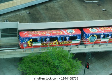 DETROIT, MICHIGAN, UNITED STATES - MAY 22nd, 2018: The Detroit People Mover Public Transit System Enters A Station. The Elevated Monorail Is One Of Many Public Modes Of Transportation In The City