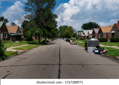 Detroit, Michigan, USA - August 20, 2014: A Suburban Street With Houses Being Evicted And People Belongings On The Lawns Near The 8 Mile Road, In The City Of Detroit.