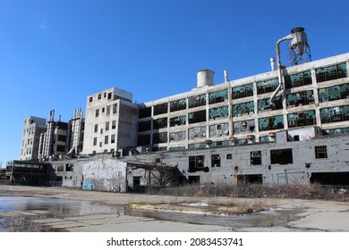 Detroit, Michigan USA, February 16, 2019, Abandoned factory in Detroit with a large puddle in front