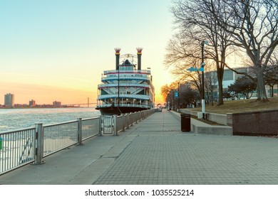 Detroit, Michigan / USA - February 27th 2018: Beautiful View Of Detroit River With Dining Cruise In Downtown Area During Sunset In A Sunny Day.