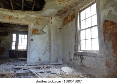 Detroit, Michigan/USA-July 2017:  Chipped And Broken White Plaster Walls And Window Of Old Military  Housing At Fort Wayne Circa 1800's.