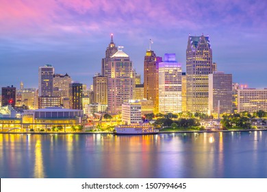 Detroit skyline in Michigan, USA at sunset shot from Windsor, Ontario Canada - Powered by Shutterstock